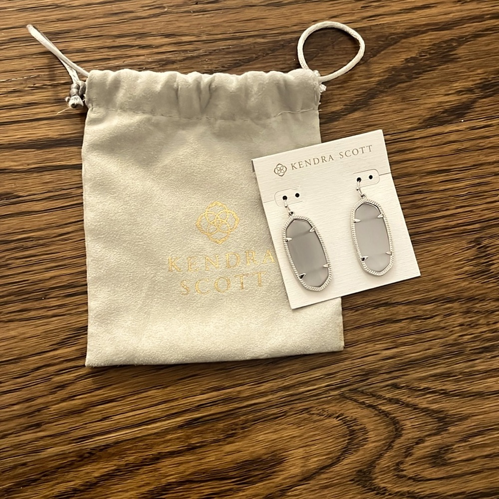 Kendra Scott Silver Elle drop earrings.